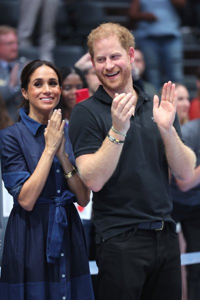 Meghan Markle and Prince Harry clap their hands