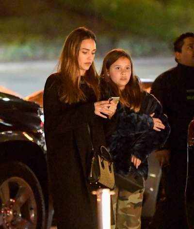 EXCLUSIVE: Jessica Alba braves the rain to take her daughters to a movie