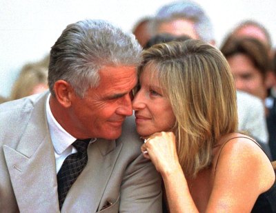 US actor James Brolin and his singer-actress wife Barbra Streisand share a tender moment during the Hollywood Walk of Fame 