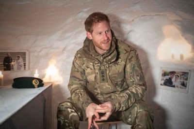 Prince Harry, Duke of Sussex in a Quincey Shelter, a makeshift shelter built of snow, during a visit to Exercise Clockwork