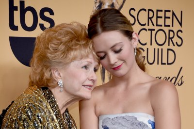 Actress Debbie Reynolds (L), recipient of the Screen Actors Guild Life Achievement Award, and Billie Lourd pose in the press room at the 21st Annual Screen Actors Guild Awards at The Shrine Auditorium
