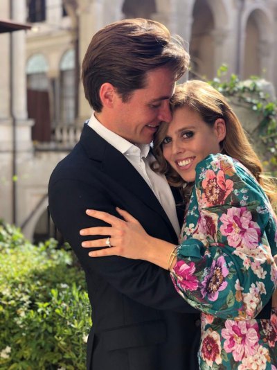 princess beatrice smiles and hugs her fiance edorado mapelli mozzi in engagement photo