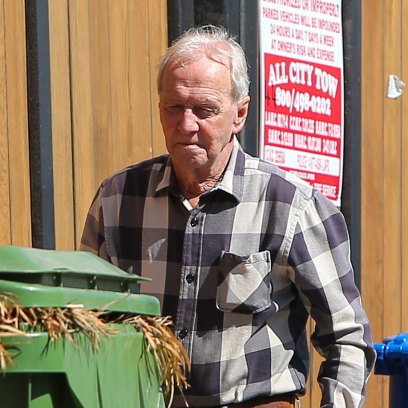 Paul Hogan is spotted wheeling out his trash bins on the morning of his 80th birthday [Tuesday October 8.]