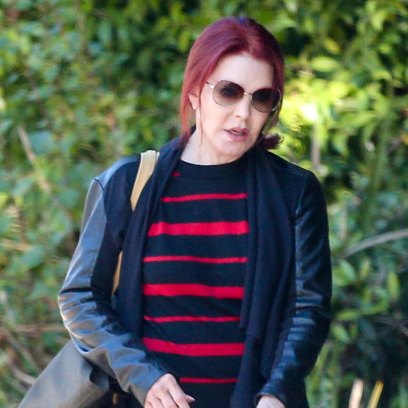 Prisilla Presley, 74, looks sleek and stylish as she goes dog walking in Beverly Hills.