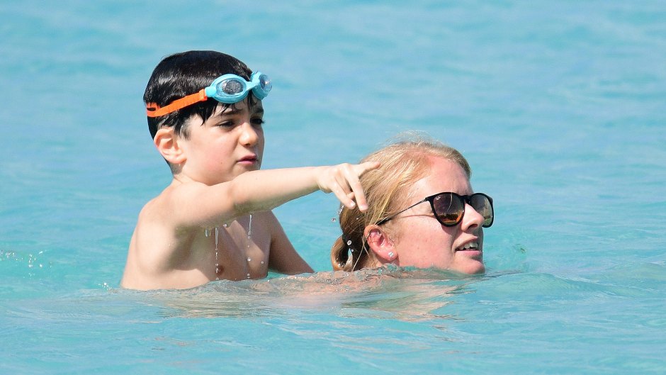 Simon Cowell's son Eric pictured with nanny on the beach in Barbados