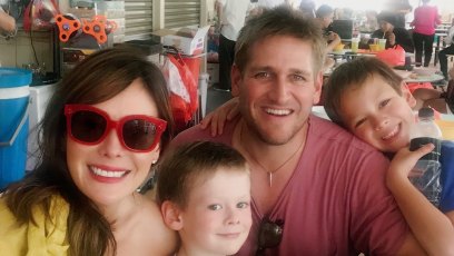 Curtis Stone Wearing a Red Shirt With His Wife and 2 Kids