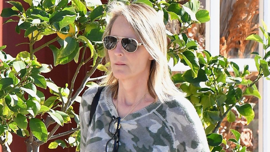 Helen Hunt wearing a camouflage hoodie and jeans seen running errands in LA