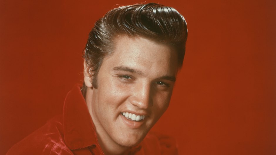 Elvis Presley Smiling in a Red Outfit