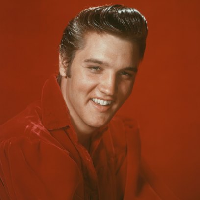 Elvis Presley Smiling in a Red Outfit