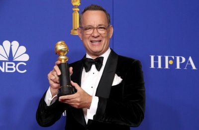 Tom Hanks Holding a Trophy at the 2020 Golden Globes