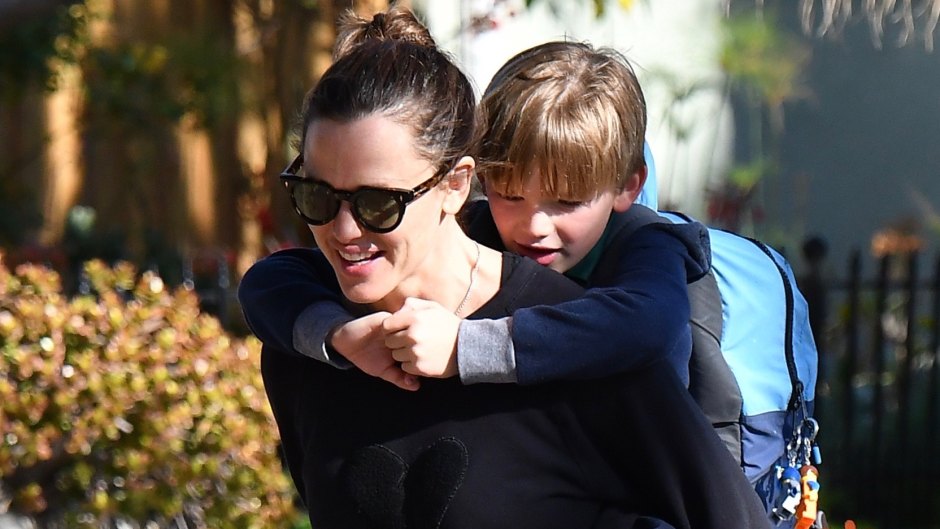 Jennifer Garner gives her son a piggyback ride after picking him up from school.