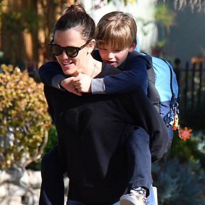 Jennifer Garner gives her son a piggyback ride after picking him up from school.