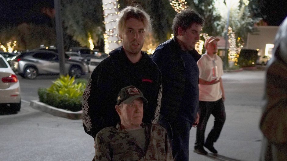 Hollywood legend James Caan looks frail as his son Jacob pushes him in a wheelchair in LA.