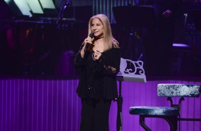 Barbra Streisand performs in a black pantsuit