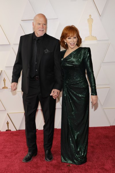Reba McEntire wears green sequined gown and Rex Linn wears black suit