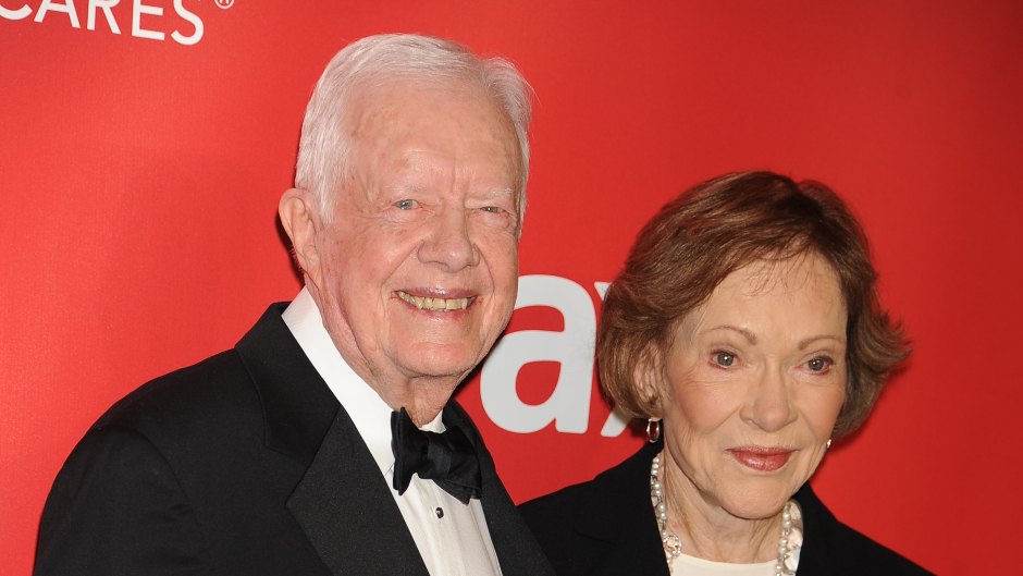 Jimmy Carter smiles next to wife Rosalynn Carter