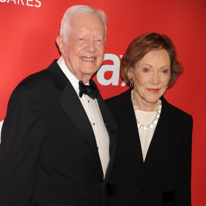 Jimmy Carter smiles next to wife Rosalynn Carter