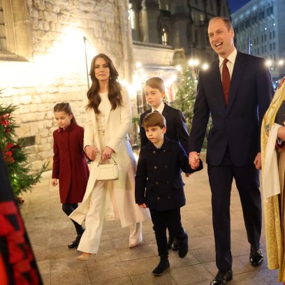 Kate Middleton and Prince William hold hands with their kids