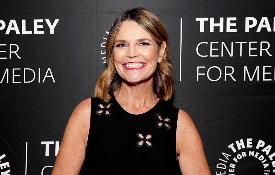 Savannah Guthrie smiles with red lipstick while wearing a black dress