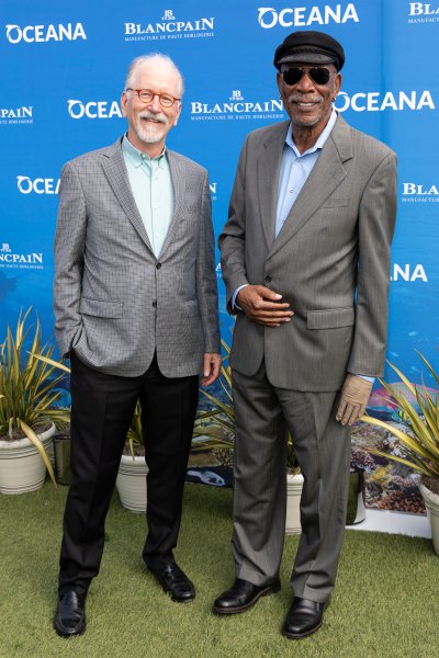 Andrew Sharpless and Morgan Freeman standing side by side