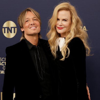 Nicole Kidman and Keith Urban pose together while wearing black suits