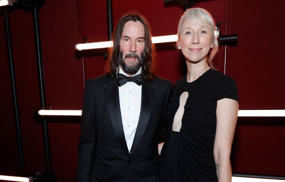 Keanu Reeves and Alexandra Grant wear black outfits on red carpet