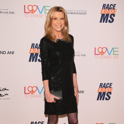 Vanna White wears short black dress with black pantyhose and heels