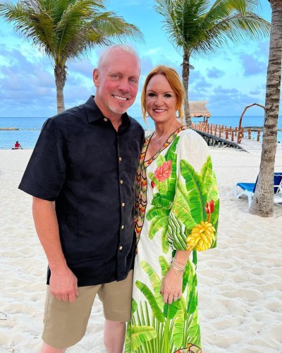 Ree and Ladd Drummond pose together on a beach
