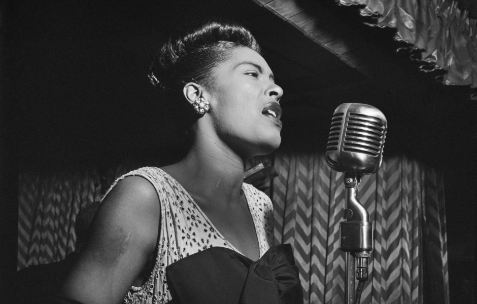 Billie Holiday singing into the microphone