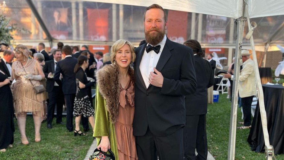 Erin and Ben Napier pose together at a wedding