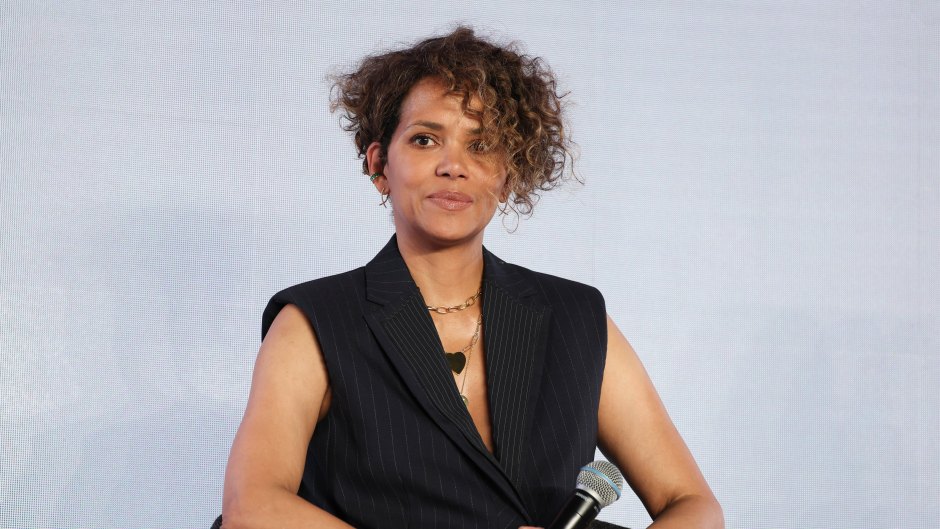 Halle Berry wears black top and white pants