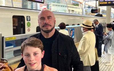 John Travolta and son Ben pose in Japanese train station