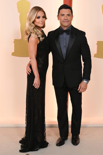 Kelly Ripa and husband Mark Consuelos attend the Oscars