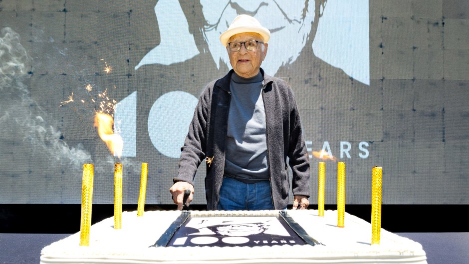 Norman Lear stands in front of birthday cake
