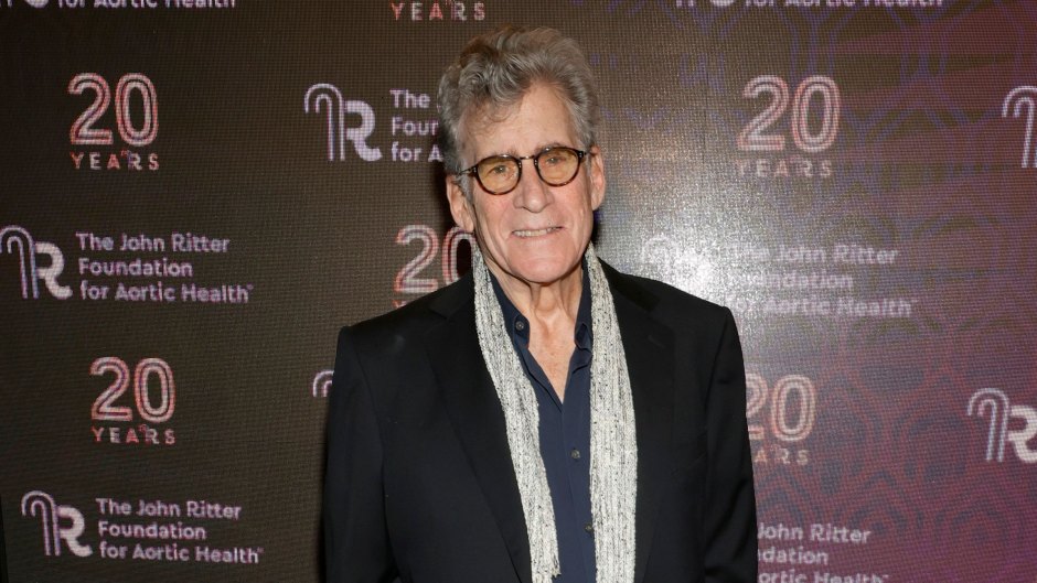 Paul Michael Glaser poses on the red carpet in a black suit