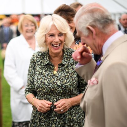 Queen Camilla laughs at a pie depicting King Charles III at Sandringham Flower Show