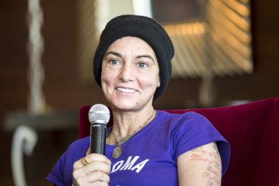 Sinead O'Connor Speaks into microphone during interview