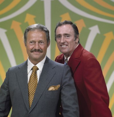 Dan Rowan and Dick Martin pose together on set of 'Laugh-In'