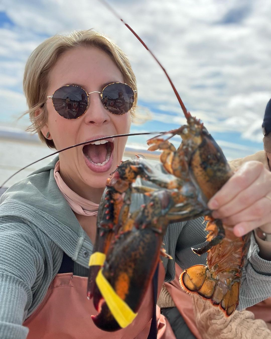 Erin Napier holds lobster in her hands