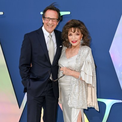 Joan Collins wears silver gown alongside husband Percy Gibson on red carpet