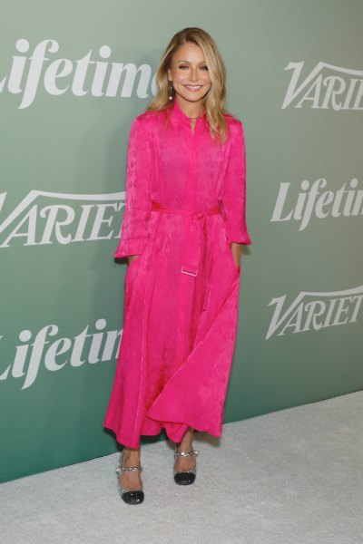 Kelly Ripa poses in pink silk dress