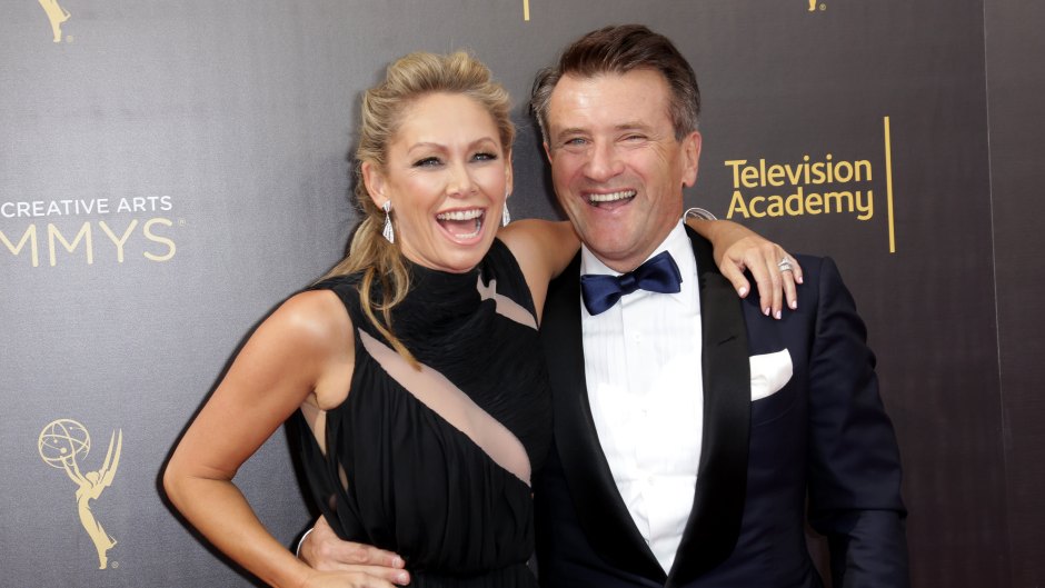 Robert Herjavec and Kym Johnson laugh together on the red carpet
