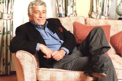 Tony Bennett lounges on a sofa