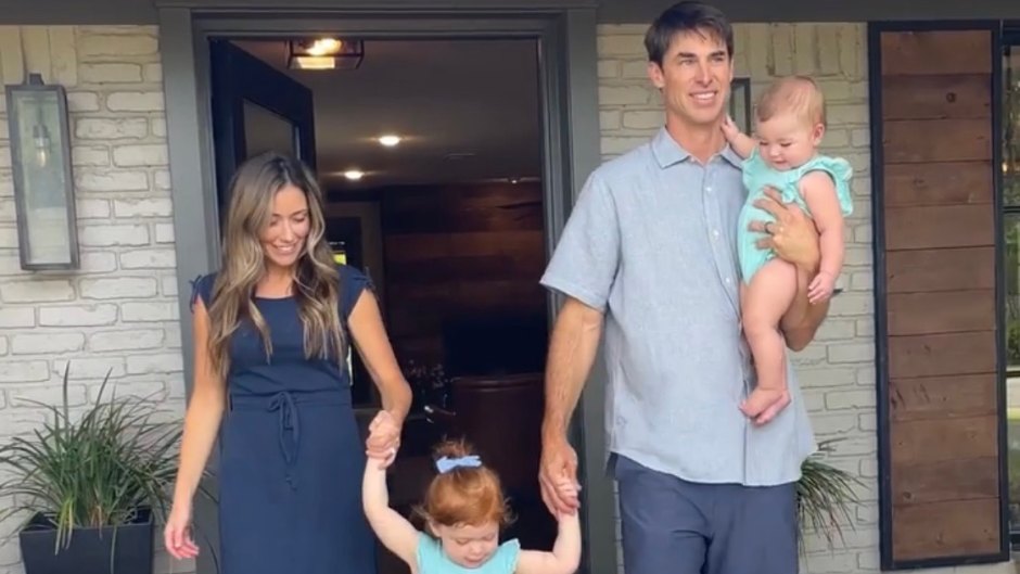 David Ridley and his family pose in front of home