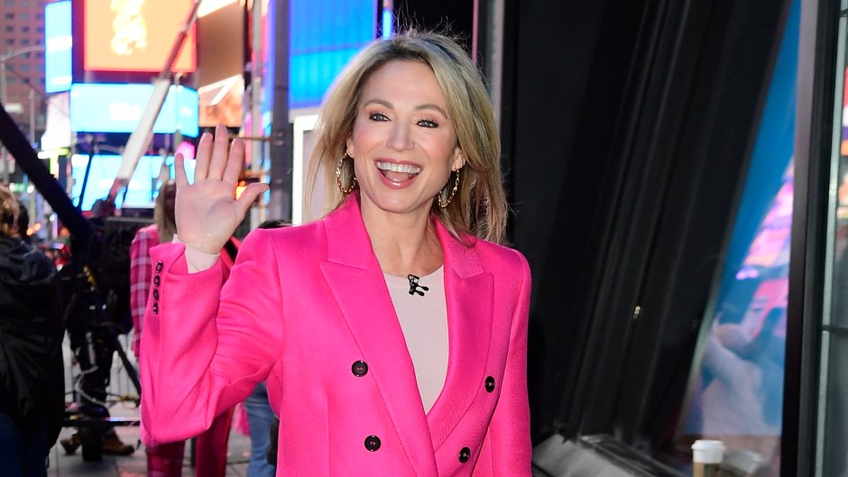 Amy Robach waves to crowd while wearing a pink jacket outside of 'GMA'