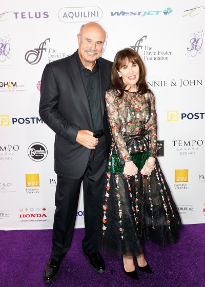 Dr. Phil and wife Robin McGraw attend event in formal wear