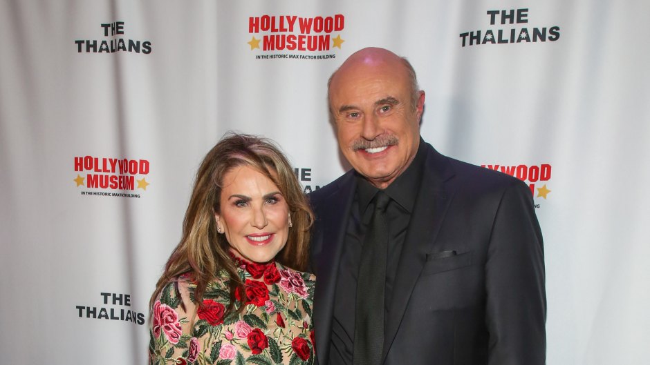 Dr. Phil and wife Robin McGraw embrace on the red carpet