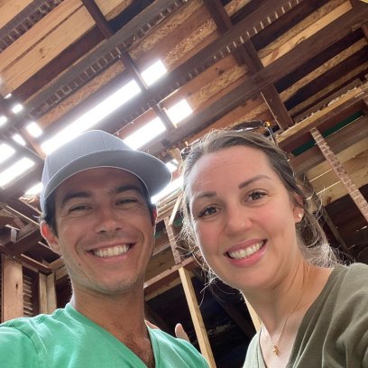 Ashley and Michael Cordray pose for selfie inside of a home