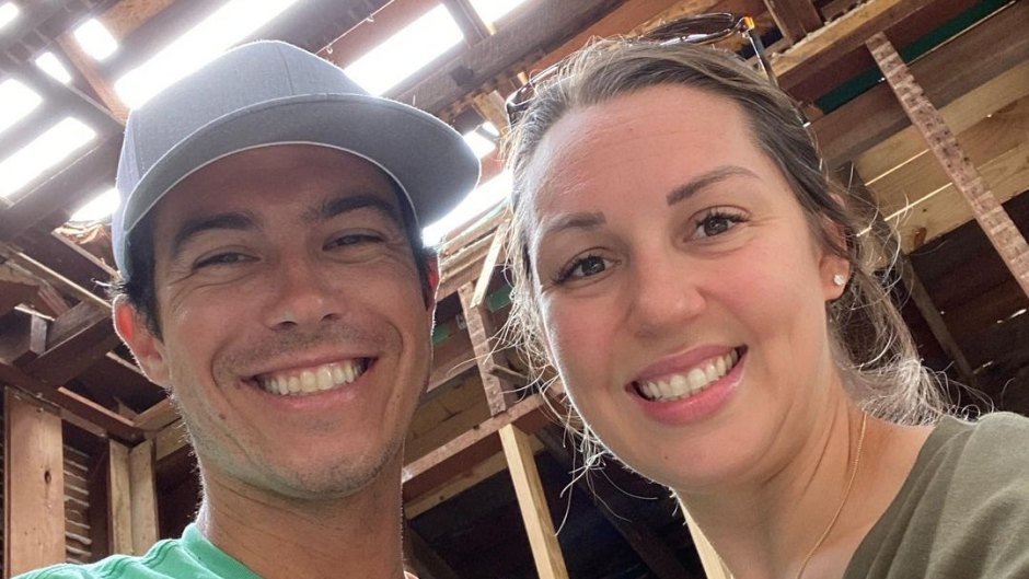 Ashley and Michael Cordray pose for selfie inside of a home