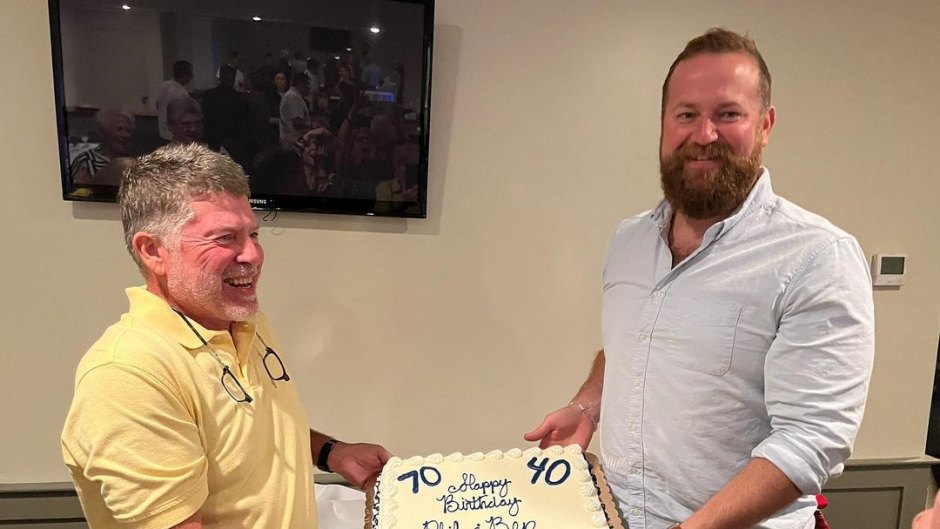 Ben Napier holds onto birthday cake with Phil Rasberry